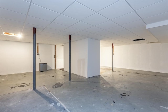 basement featuring a drop ceiling