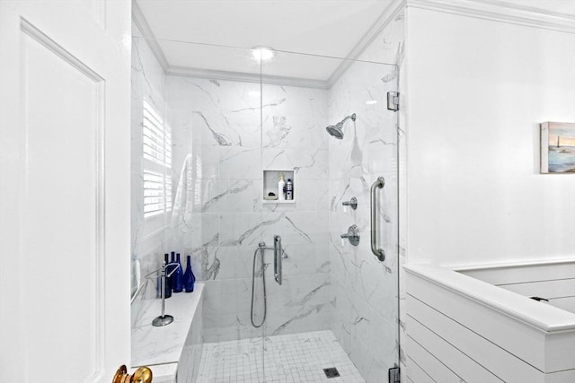bathroom featuring a marble finish shower