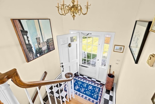 foyer entrance featuring a chandelier