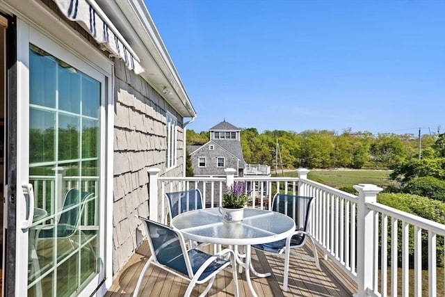 balcony featuring outdoor dining space