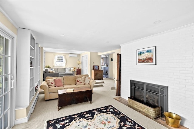 living area with carpet floors, a wall unit AC, and a fireplace
