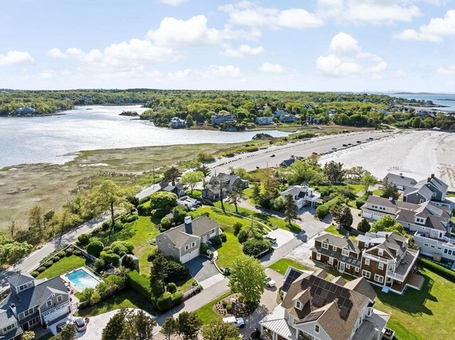aerial view of residential area with a large body of water