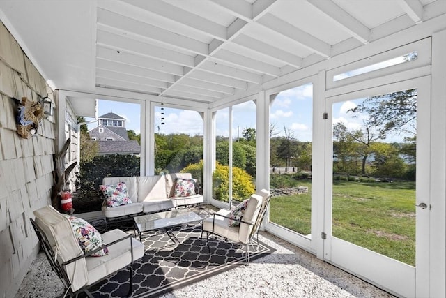 sunroom / solarium featuring an outdoor hangout area and beamed ceiling