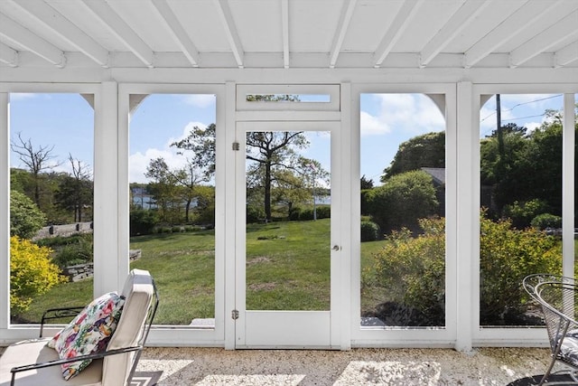 sunroom with beamed ceiling