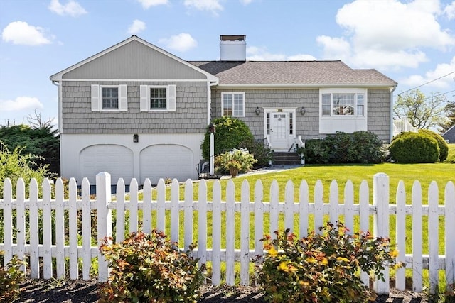 view of front facade featuring an attached garage and a chimney