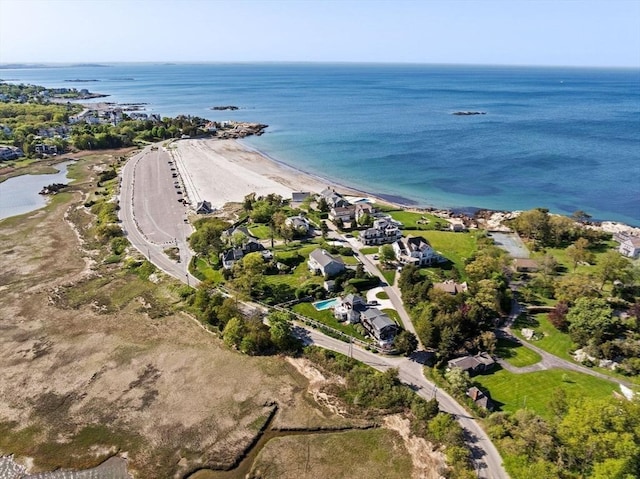 aerial view of property and surrounding area featuring a large body of water