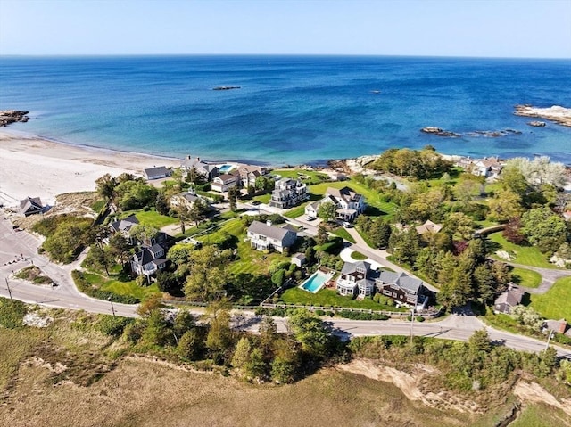 view of property location with waterfront with a beach
