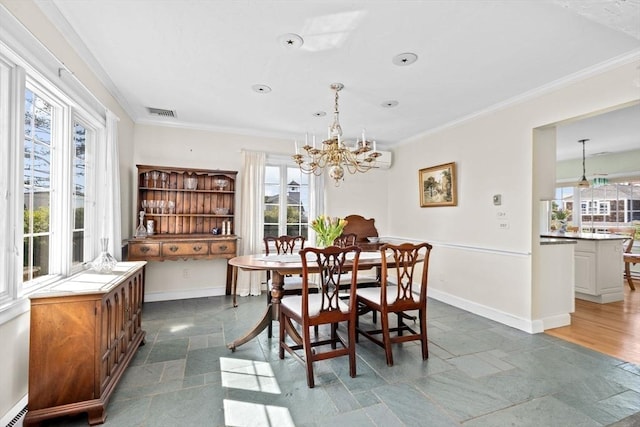 dining area with stone tile floors, crown molding, a chandelier, a baseboard radiator, and baseboards