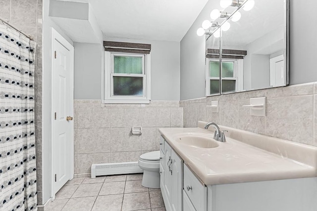 full bath featuring baseboard heating, tile walls, tile patterned floors, vanity, and toilet