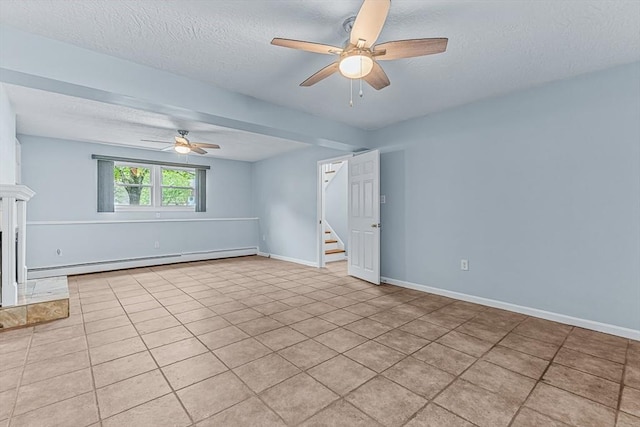unfurnished room featuring a baseboard radiator, ceiling fan, a textured ceiling, stairway, and baseboards