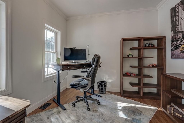 office area featuring wood-type flooring and ornamental molding