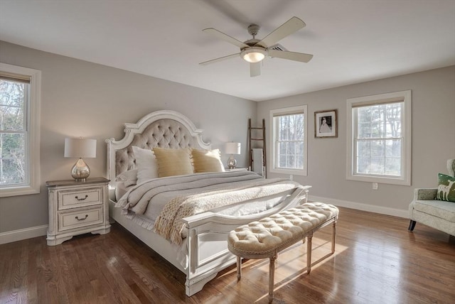 bedroom featuring ceiling fan and dark hardwood / wood-style flooring