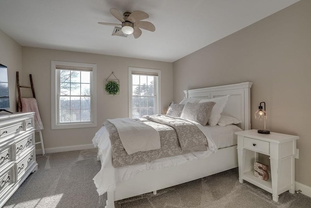 bedroom featuring light carpet and ceiling fan