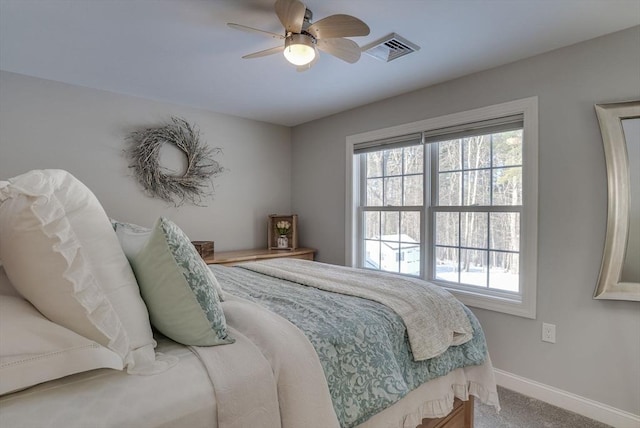 bedroom with multiple windows, carpet floors, and ceiling fan