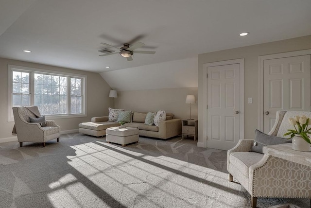 carpeted living room with vaulted ceiling and ceiling fan