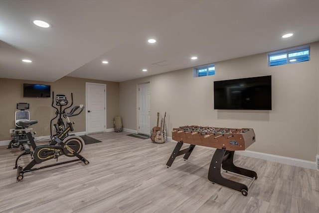 exercise area with light hardwood / wood-style floors