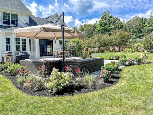 view of yard with outdoor lounge area and a patio