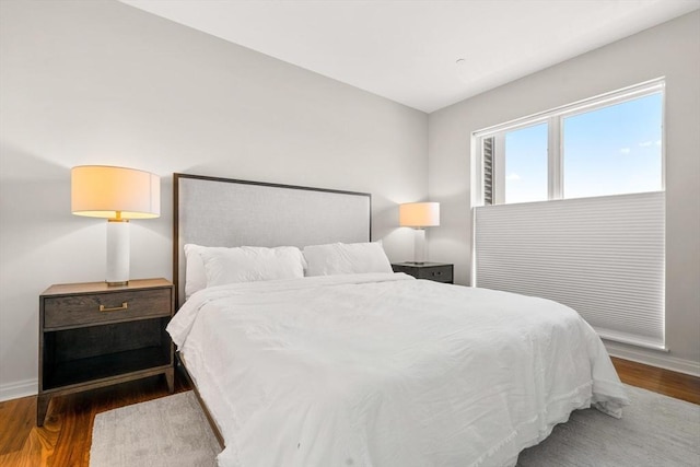 bedroom featuring dark hardwood / wood-style flooring