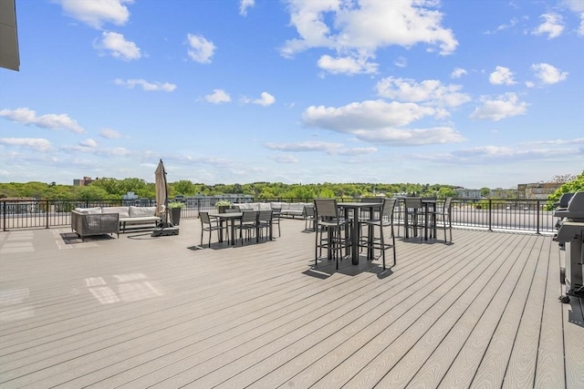 wooden terrace featuring an outdoor living space