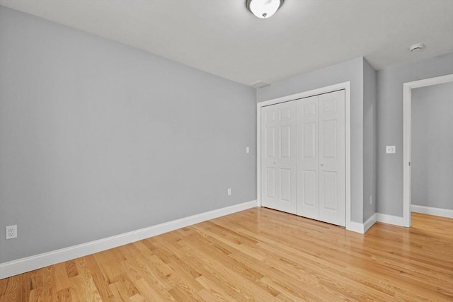 218 Tuttle St, Fall River, MA 02724 - unfurnished bedroom featuring light wood-type flooring and a closet