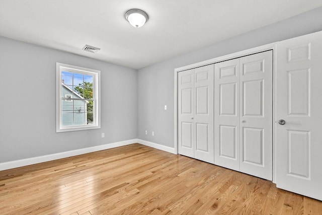 218 Tuttle St, Fall River, MA 02724 - unfurnished bedroom featuring light wood-style floors and a closet