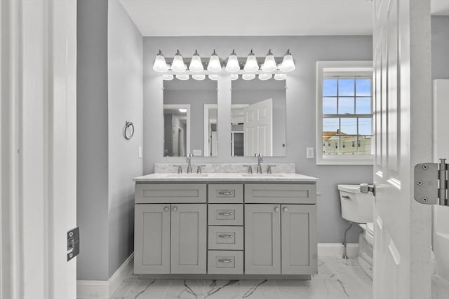 218 Tuttle St, Fall River, MA 02724 - bathroom featuring marble look tiles and double vanity