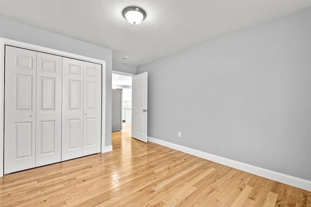218 Tuttle St, Fall River, MA 02724 - unfurnished bedroom featuring light wood-style flooring and a closet