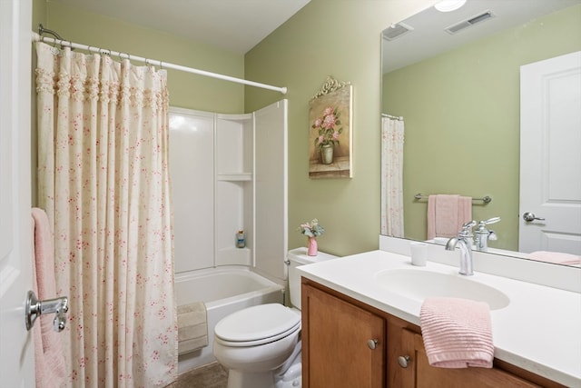 full bathroom with vanity, toilet, and shower / bath combo