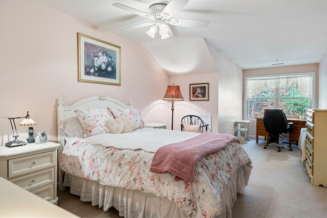 carpeted bedroom featuring ceiling fan and lofted ceiling