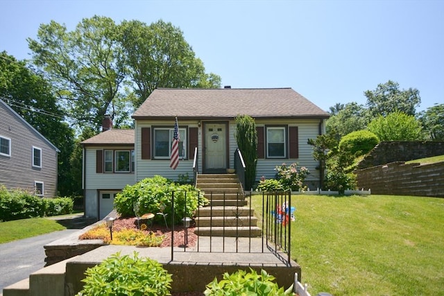 6 Ayrshire Rd, Worcester, MA 01604 - view of front of home featuring a front yard, an attached garage, and asphalt driveway