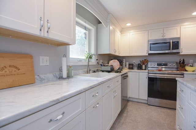 6 Ayrshire Rd, Worcester, MA 01604 - kitchen with appliances with stainless steel finishes, white cabinets, recessed lighting, and light stone counters