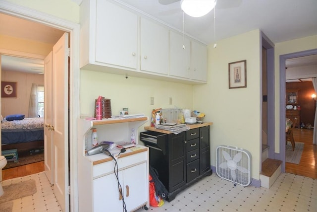 6 Ayrshire Rd, Worcester, MA 01604 - kitchen featuring light floors, white cabinetry, light countertops, ceiling fan, and dark cabinetry