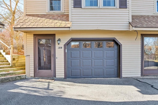 entrance to property featuring a garage