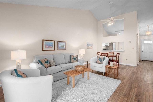 53 Chilton Ln Unit 53, Brewster, MA 02631 - living area featuring wood finished floors, ceiling fan, baseboards, and high vaulted ceiling