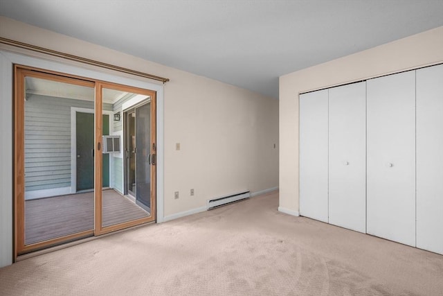 53 Chilton Ln Unit 53, Brewster, MA 02631 - unfurnished bedroom with a closet, baseboards, baseboard heating, carpet floors, and access to outside