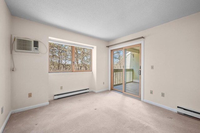 53 Chilton Ln Unit 53, Brewster, MA 02631 - empty room with baseboard heating, carpet flooring, and a wall mounted AC