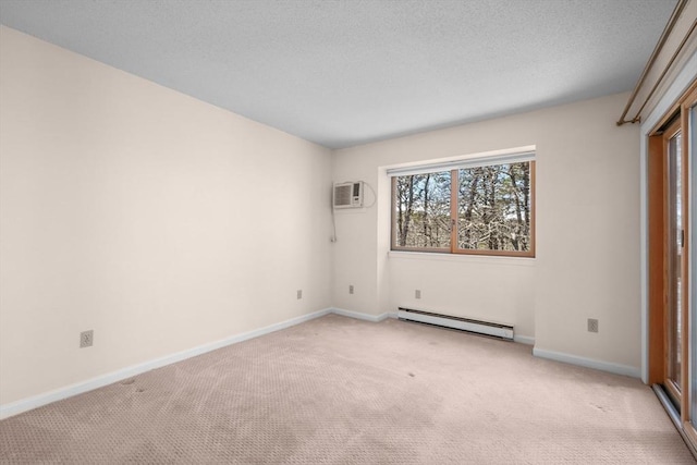 53 Chilton Ln Unit 53, Brewster, MA 02631 - unfurnished room with a textured ceiling, baseboard heating, light carpet, an AC wall unit, and baseboards