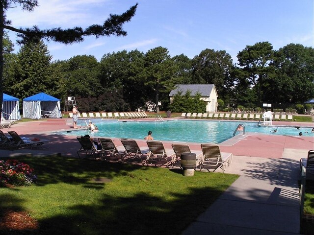 53 Chilton Ln Unit 53, Brewster, MA 02631 - pool with a patio area, fence, and a yard