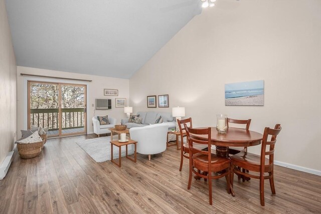 53 Chilton Ln Unit 53, Brewster, MA 02631 - dining area with high vaulted ceiling, baseboards, a ceiling fan, and wood finished floors