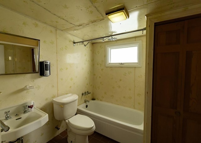 bathroom with tile patterned floors, toilet, and sink