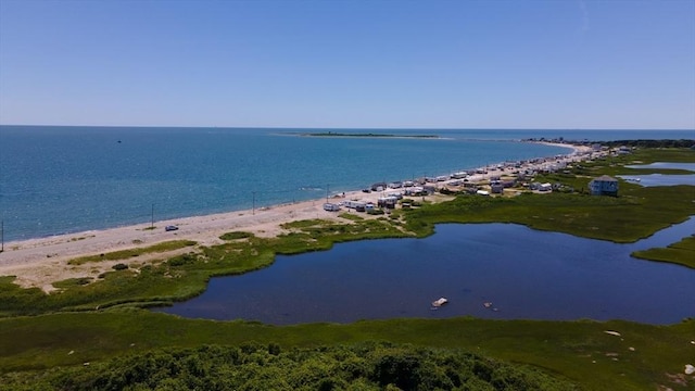 drone / aerial view with a beach view and a water view