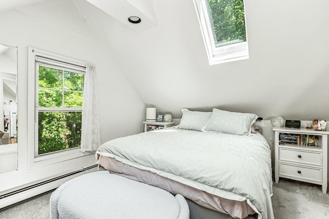 bedroom with a baseboard heating unit, lofted ceiling, carpet flooring, and a skylight