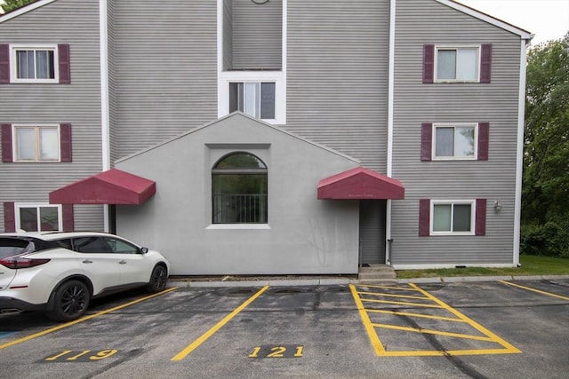 120 Fisherville Rd Unit 121, Concord, NH 03303 - view of property featuring uncovered parking