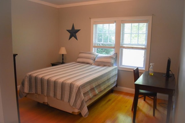 23 Beech St Unit 2, Framingham, MA 01702 - bedroom with light wood-style floors and crown molding