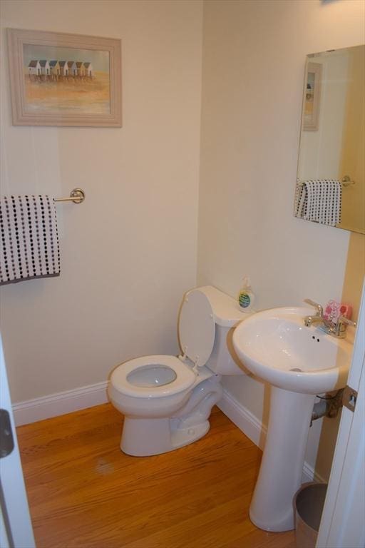 23 Beech St Unit 2, Framingham, MA 01702 - half bath with baseboards and wood finished floors