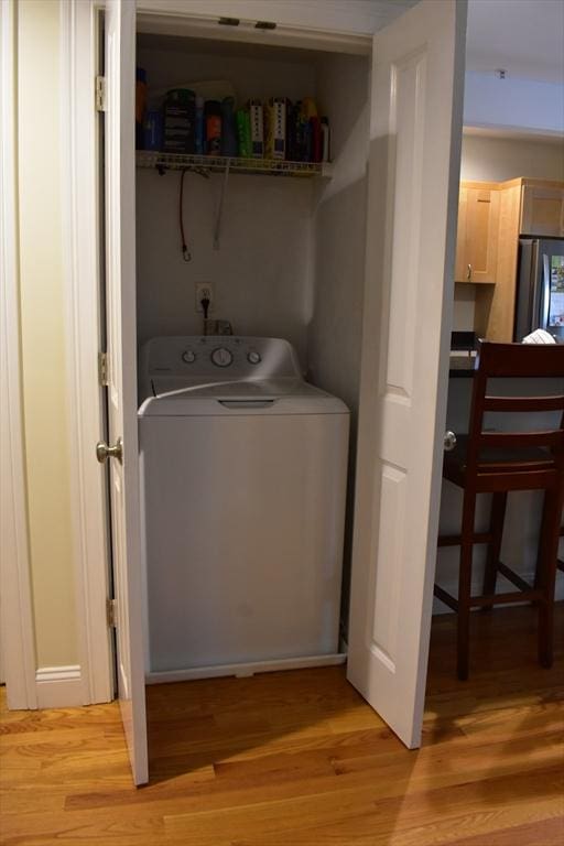 23 Beech St Unit 2, Framingham, MA 01702 - washroom featuring washer / clothes dryer and light wood-style floors