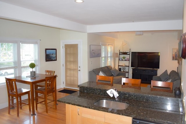23 Beech St Unit 2, Framingham, MA 01702 - kitchen featuring light wood-type flooring, recessed lighting, dark stone countertops, and open floor plan