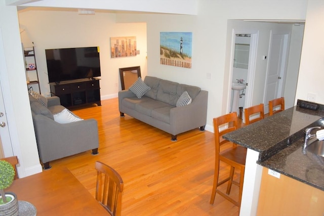 23 Beech St Unit 2, Framingham, MA 01702 - living area with light wood-style floors
