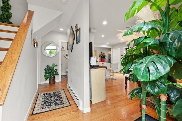 99 Lincoln St, Stoughton, MA 02072 - foyer with a baseboard heating unit, wood finished floors, recessed lighting, baseboards, and stairway