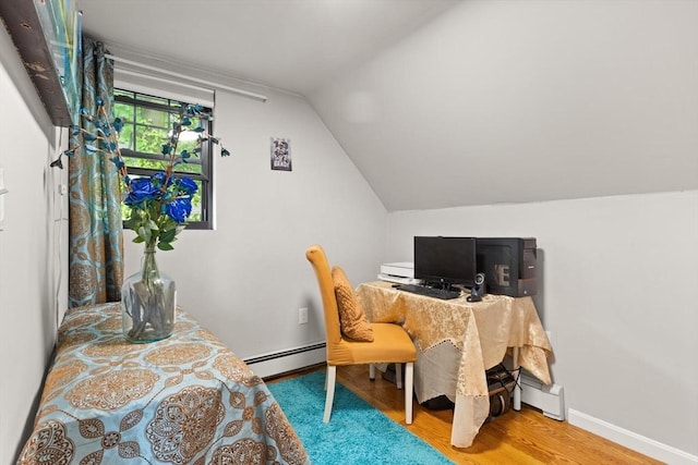 99 Lincoln St, Stoughton, MA 02072 - home office featuring a baseboard heating unit, wood finished floors, baseboard heating, lofted ceiling, and baseboards